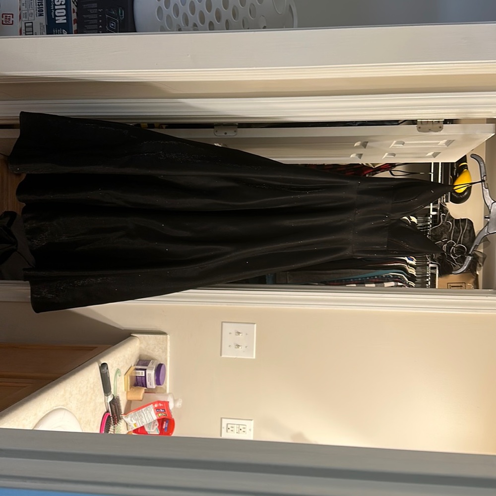 Black ball gown size 4, no alterations done. Worn once for a few hours